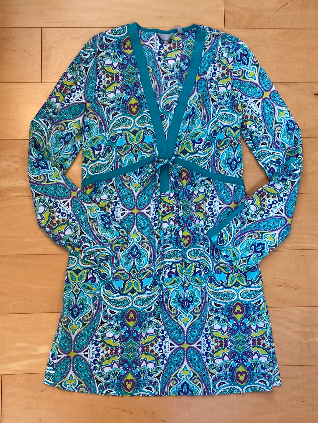 Aqua long sleeve cotton cover-up with floral paisley print and shades of green and blue deep V-neck tie at waist