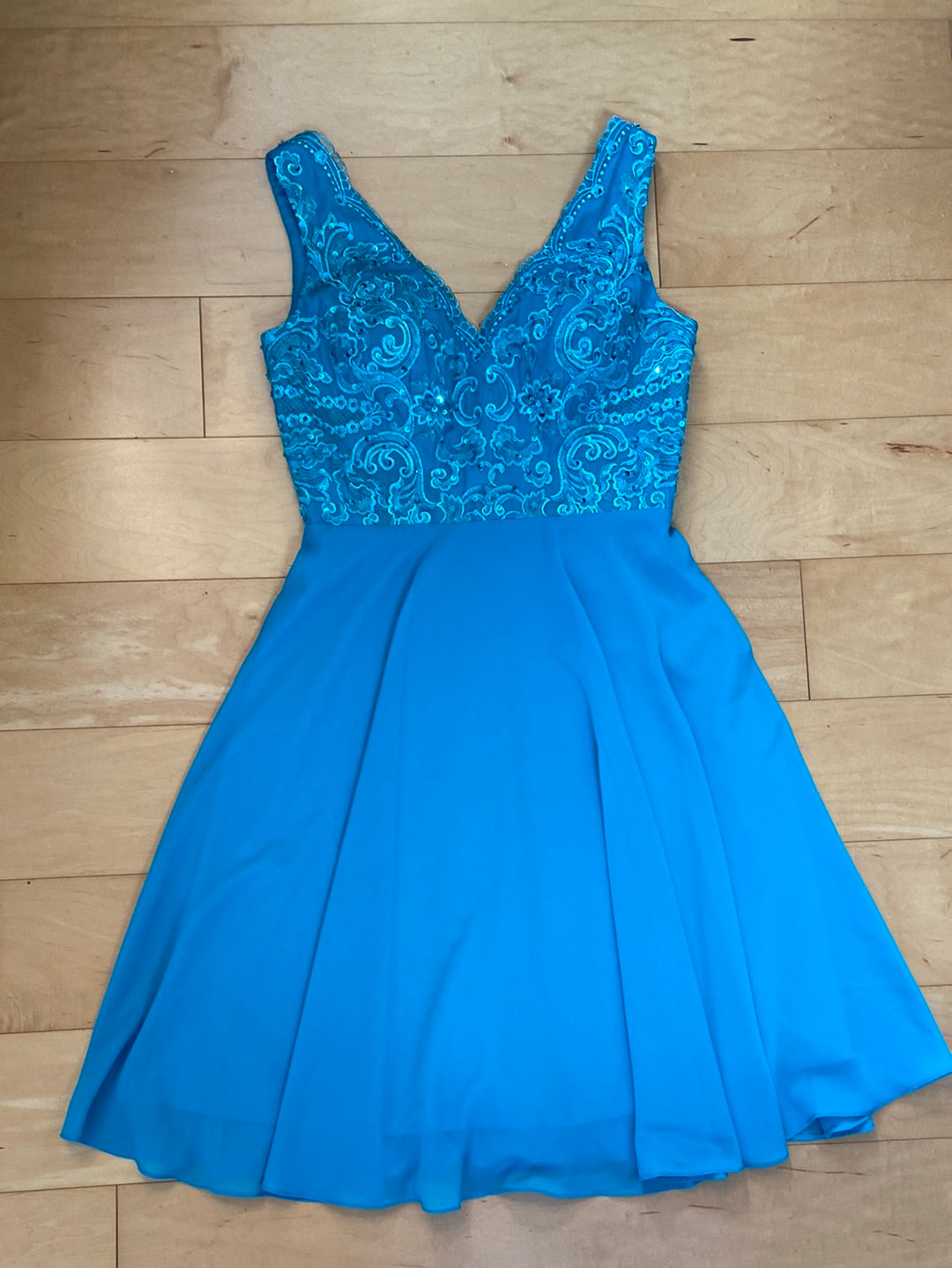 Aqua semi formal dress with detailed beaded bodice with lace and chiffon skirt fit and flare style V-neck sleeveless skirt to the knee