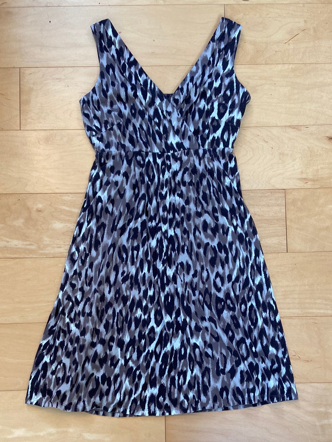 Sleeveless animal print cheetah dress in shades of brown and black kneelength crossover bodice