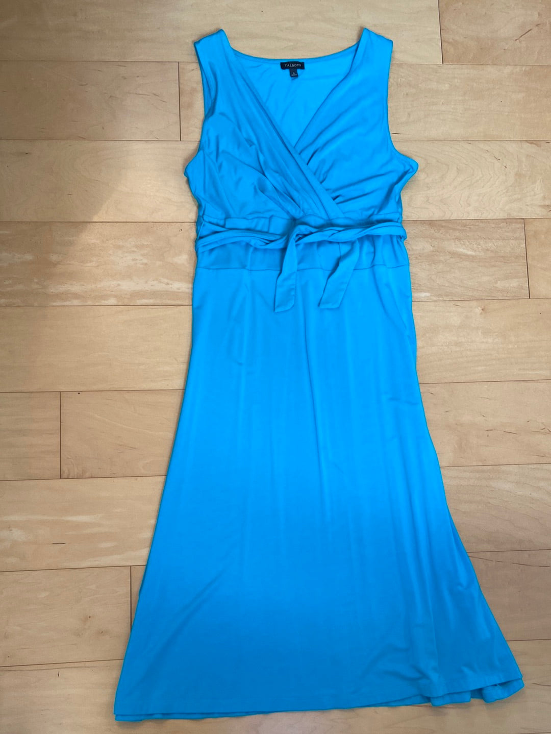 Sleeveless aqua midi dress with crossover bodice tie waist